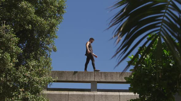 Caucasian man practicing parkour