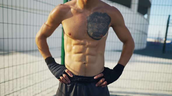 Sweat Athlete Man with Lion Tattoo Boxing Concept