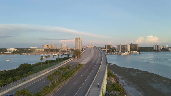 bridge over the ocean in Clearwater beach island, Florida during sunset. Aerial view