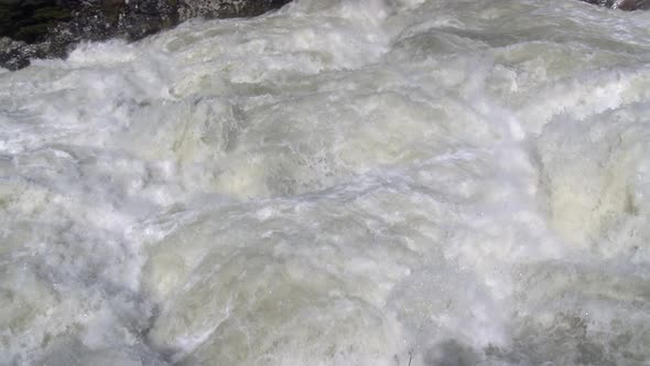 Fast Foamy Stream of the Mountain River