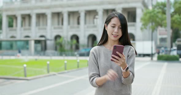 Woman use of cellphone in city of Hong Kong