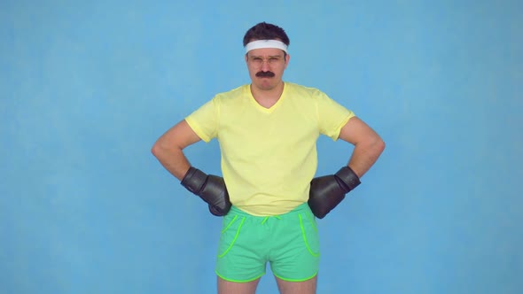 Serious Man with a Mustache From 80 x in Boxing Gloves