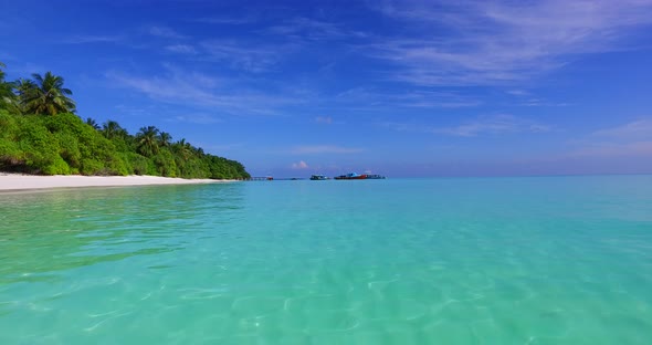 Wide angle overhead abstract shot of a white sandy paradise beach and turquoise sea background in hi