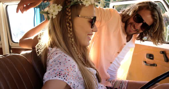 Hipster couple sitting in a van