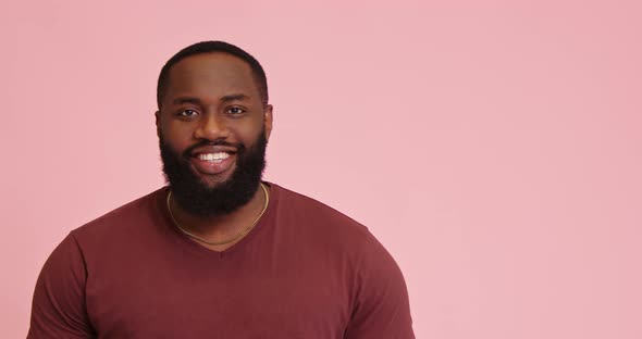 Young African American Man Smile Isolated on Pink Background