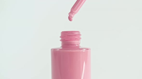 Foundation for Face Concealer Cosmetic Liquid Foundation Drips From a Pipette Into a Bottle