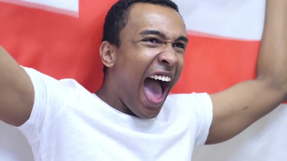 English Fan Celebrating While Holding the Flag of England in Slow Motion