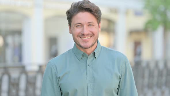 Outdoor Middle Aged Man Smiling at Camera