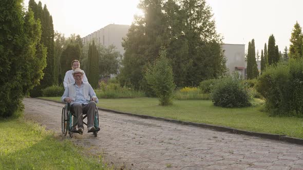 Happy Smile of a Man in Wheelchair Park Road