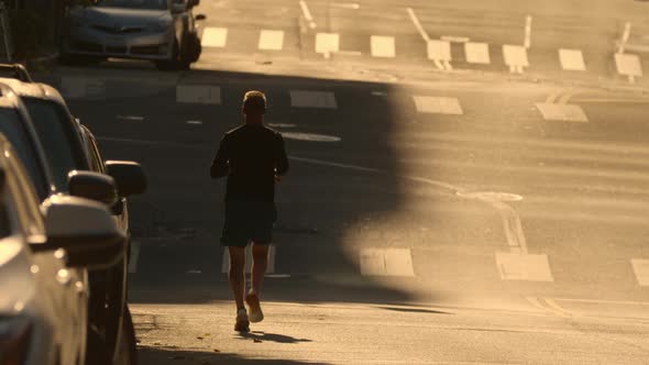 Runner Silhouette Jogging By City Street Man Running Endurance Urban Workout