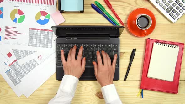 Woman Typing On Laptop