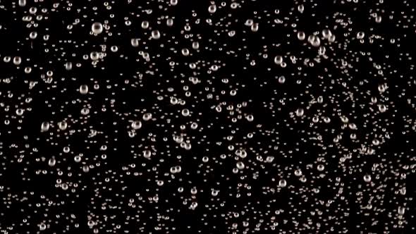 Slow Motion Shot of Moving Air Bubbles Isolated on Black Background