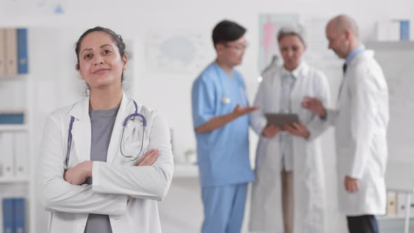 Confident Female Doctor Posing on Camera