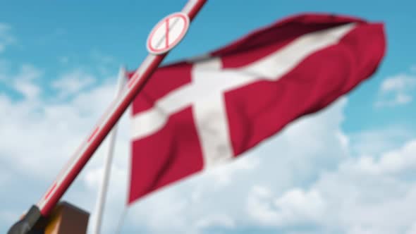 Closed Gate with No Immigration Sign at Flag of Denmark