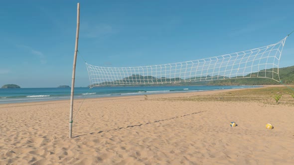 Pan Slow Motion Shot Over Volleyball Net on the Tropical Beach on Sunny Day
