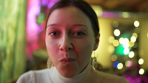 Woman Eats Salad and Enjoys Atmosphere Sitting in Cafe