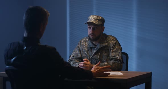 Policeman Interrogating a Soldier