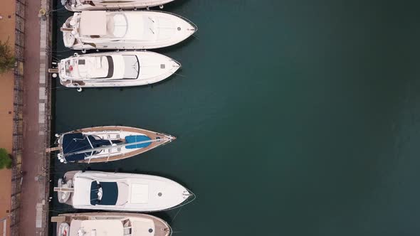 Aerial View on Moored White Sailing Yachts, Catamarans and Boats at Portorosa, Furnari, Italy