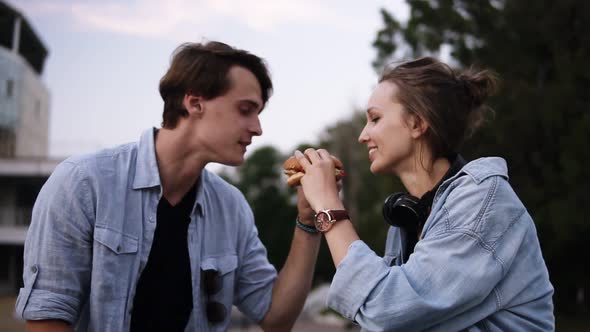 Young People are Biting a Big Burger Together