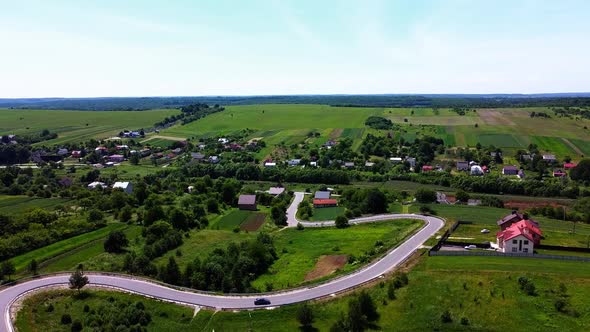 Aerial drone view of a flying over the rural agricultural landscape.