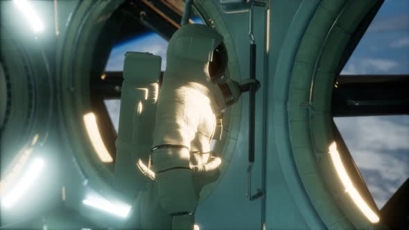 Astronaut Inside the Orbital Space Station alt