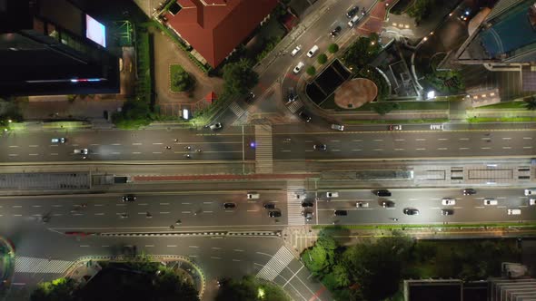 Top Down Overhead Birds Eye Aerial View of Cars and Motorcycles Driving Through a Busy Multi Lane