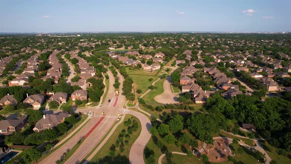 Aerial footage of a neighborhood in Flower Mound Texas. Flying towards Clearpoint Dr. and Flower Mou