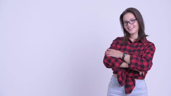 Happy Young Beautiful Hipster Woman Touching Something and Crossing Arms