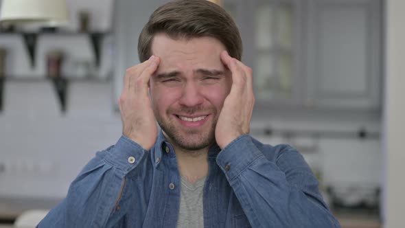 Portrait of Tired Beard Young Man Having Headache