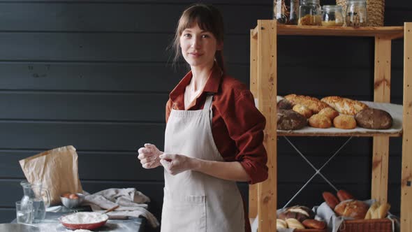 Portrait of Beautiful Female Bakery Chef in Kitchen