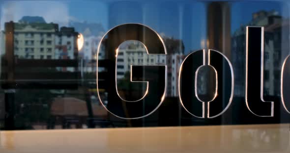 Glass Gold Letters and Office in Background