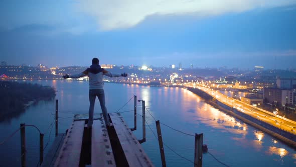 Freedom, Man Raising Hands on Top of Bridge, Enjoying Amazing Night View on City