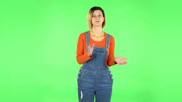 Girl Claps Her Hands Indifferently. Green Screen