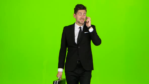 Businessman Is a Diplomat, a Telephone Rings To Him and He Talks. Green Screen
