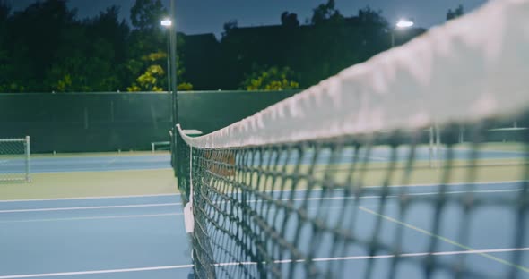 Tennis Circuit Surrounded By Bright Lighting