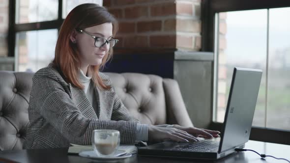 Portrait of Cheerful Smiling Girl, Young Business Woman Working at Laptop Computer, Checking Online