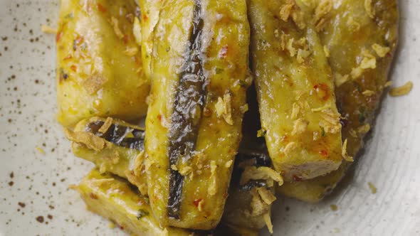 Top View of Tempura Aubergine Slices with Spicy Spices and Cane Sugar Syrup