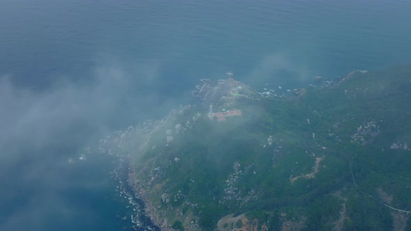 Drone view of Dai Lanh lighthouse on Dien cape - the easternmost of Vietnam - in a cloudy day. Phu Y