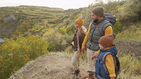 Family of Three Looking at Scenery on Hike