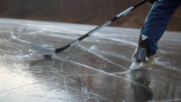 Ice Hockey Player Point of View Shot of a Puck Being Shot on Frozen Lake, Professional Player