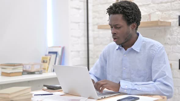 African Man Having Coughing While Working