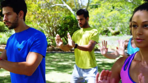 Group of people exercising in the park 4k