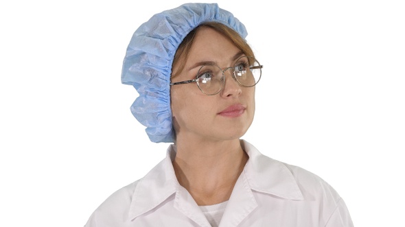 Woman doctor in glasses and hat walking and looking around