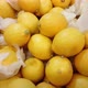 Pile of soft yellow lemons in a market, pan motion  - VideoHive Item for Sale
