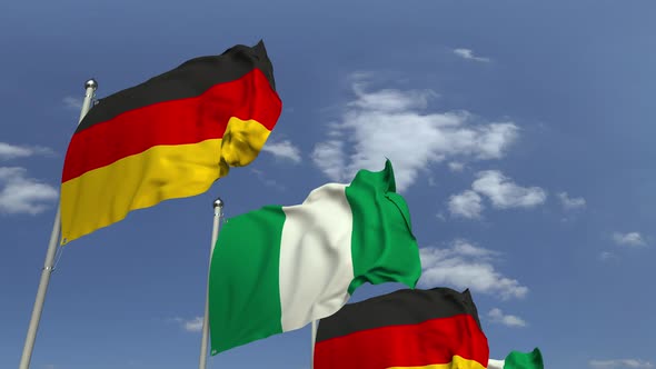 Flags of Nigeria and Germany Against Blue Sky