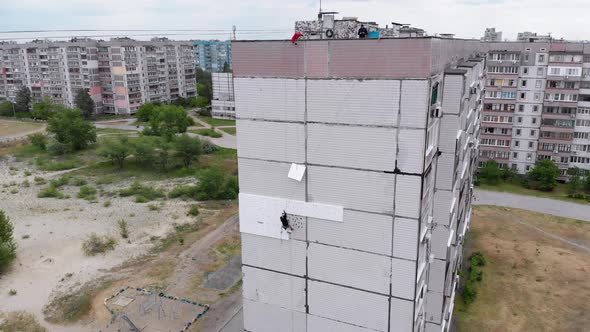 Industrial Alpinism. Aerial View. Work on Outer Insulate Building with Styrofoam