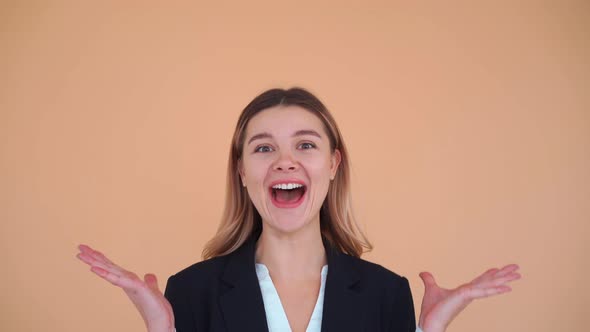 Young Business Woman Winner Gesture Laughs and Dancing in Studio Dressed Black Jacket