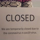 Close Up Business Owner Puts Closed Sign on Glass Door Due to Coronavirus - VideoHive Item for Sale