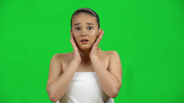 Shocked Woman in Towel with Open Mouth Very Scared on Green Screen at Studio