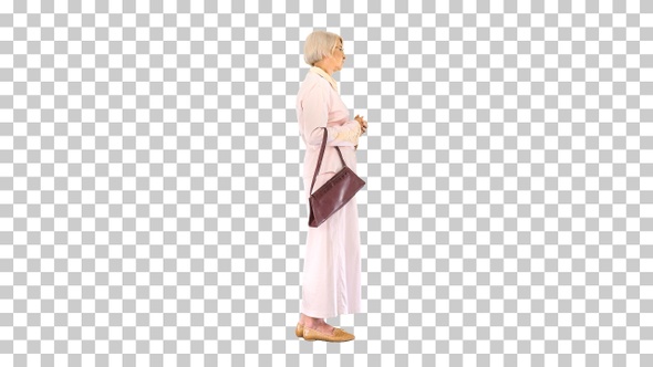 Old woman lady in pink dress standing and waiting, Alpha Channel